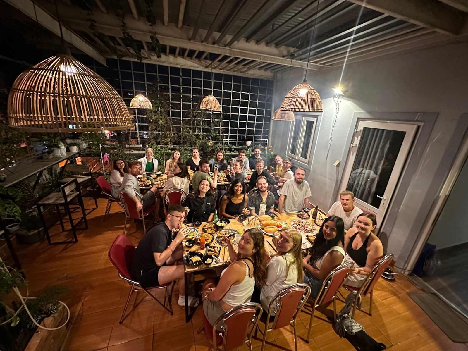 Guests gathered for a rooftop BBQ under lanterns at Mooka's Home, Da Lat