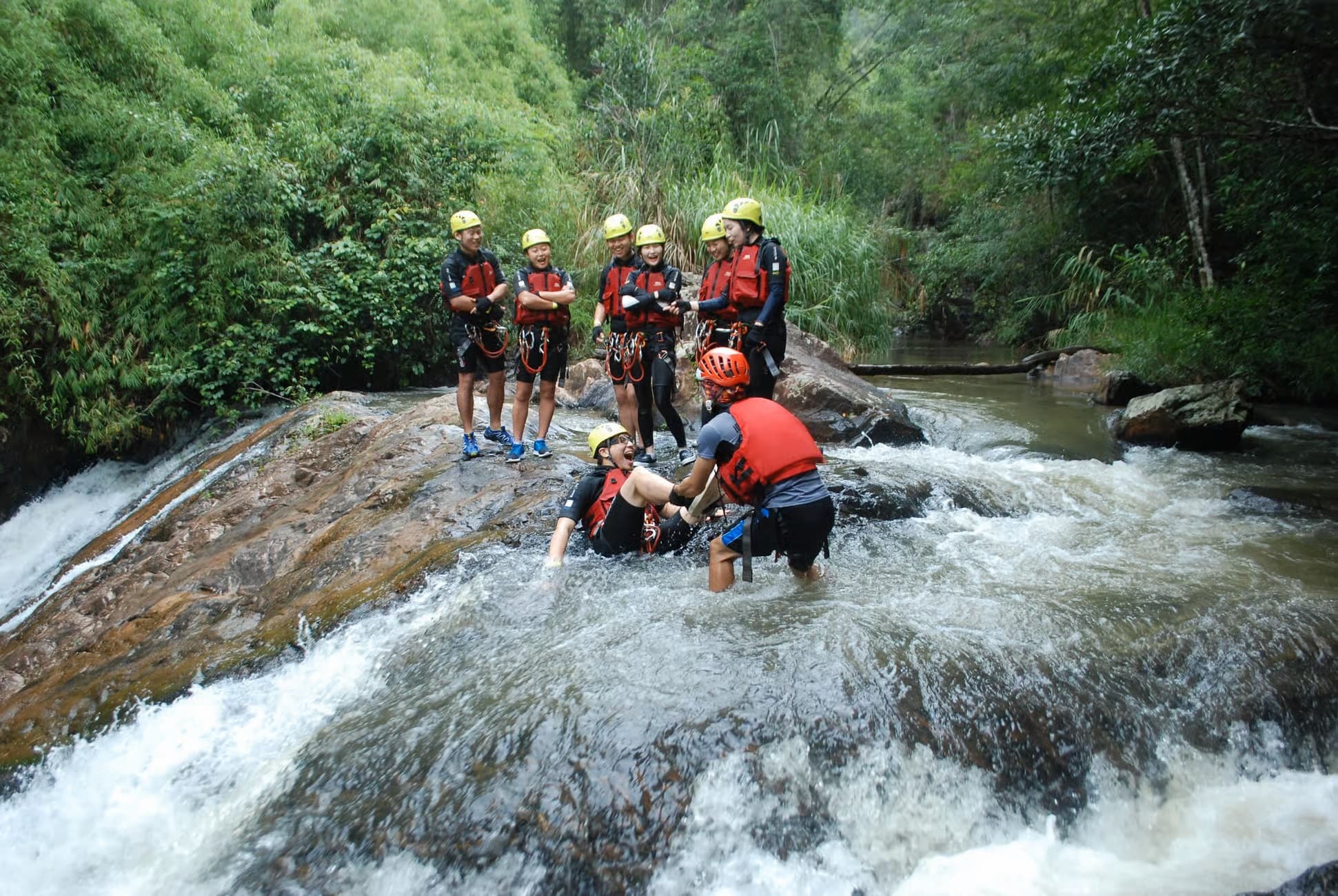 Canyoning group in safety gear at Datanla, Da Lat