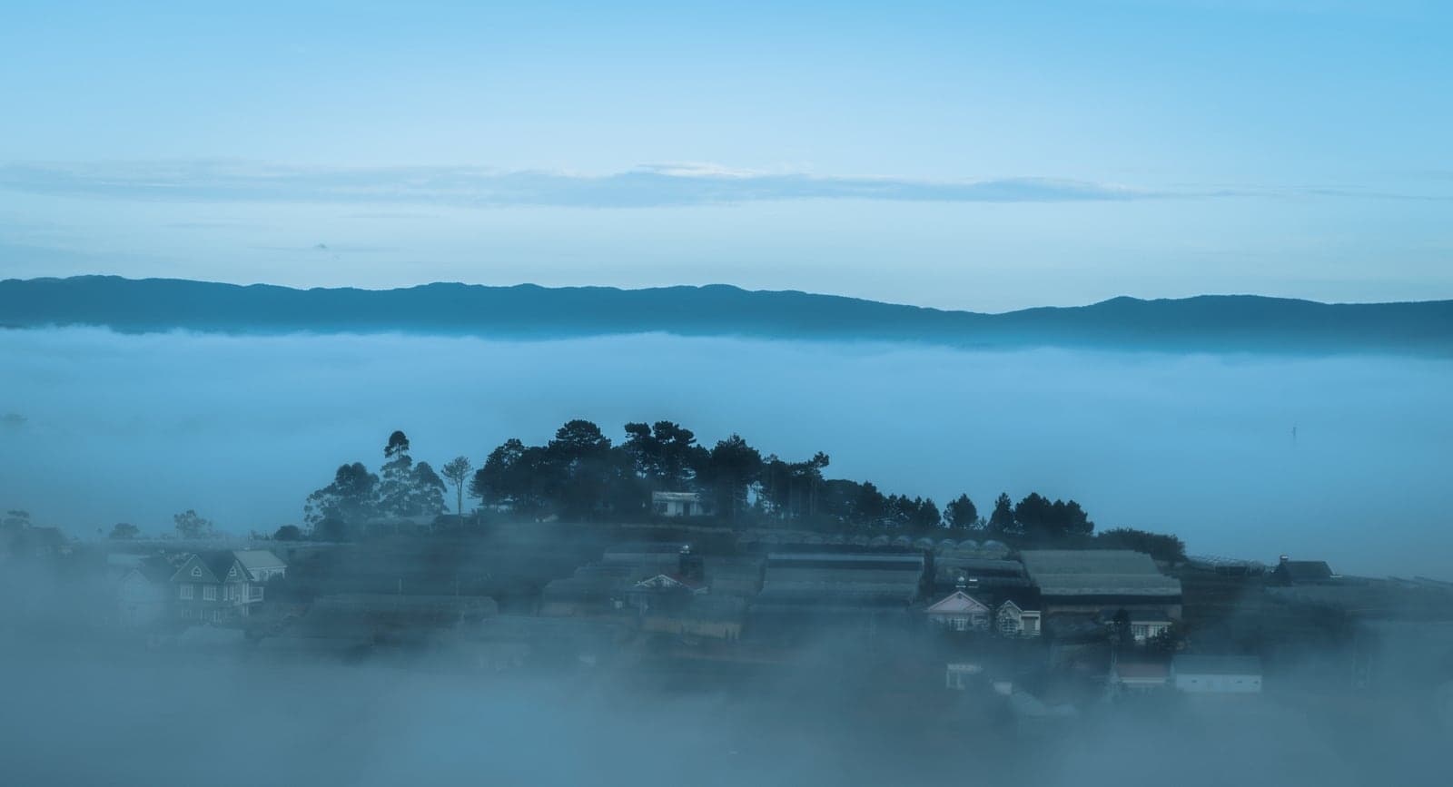 Sea of clouds at sunrise over the hills near Da Lat